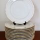 Set of 12 flat plates made of Limoges porcelain