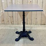 Modern bistro table, cast iron base, laminated top