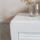Old white asymmetrical chest of drawers