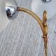 Pair of frosted glass wall lights with brass attachments, circa 1970