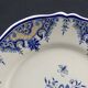 Ancien plat en faïence décor au panier fleuri