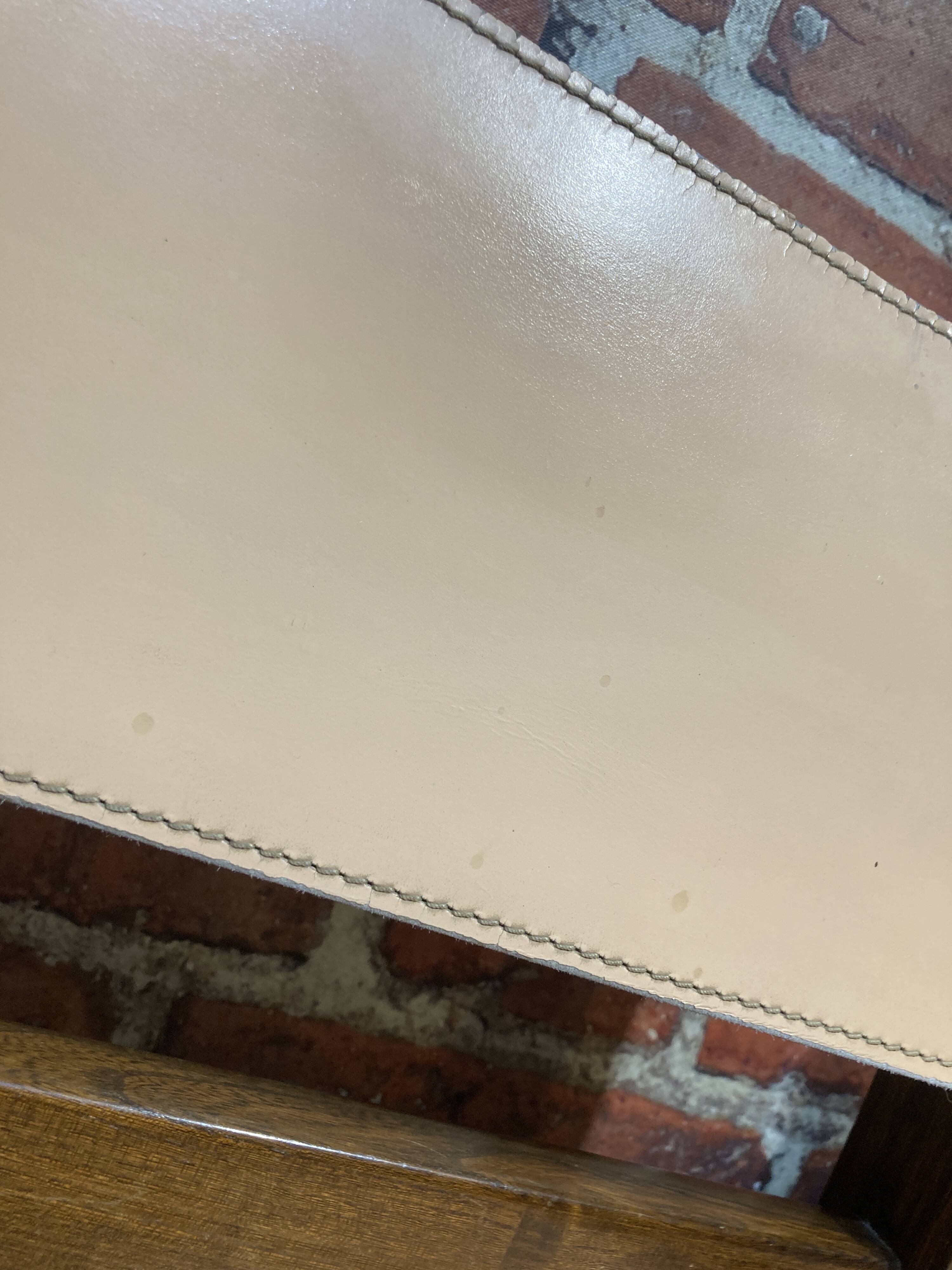 Set of four wooden and leather chairs from Maison Regain