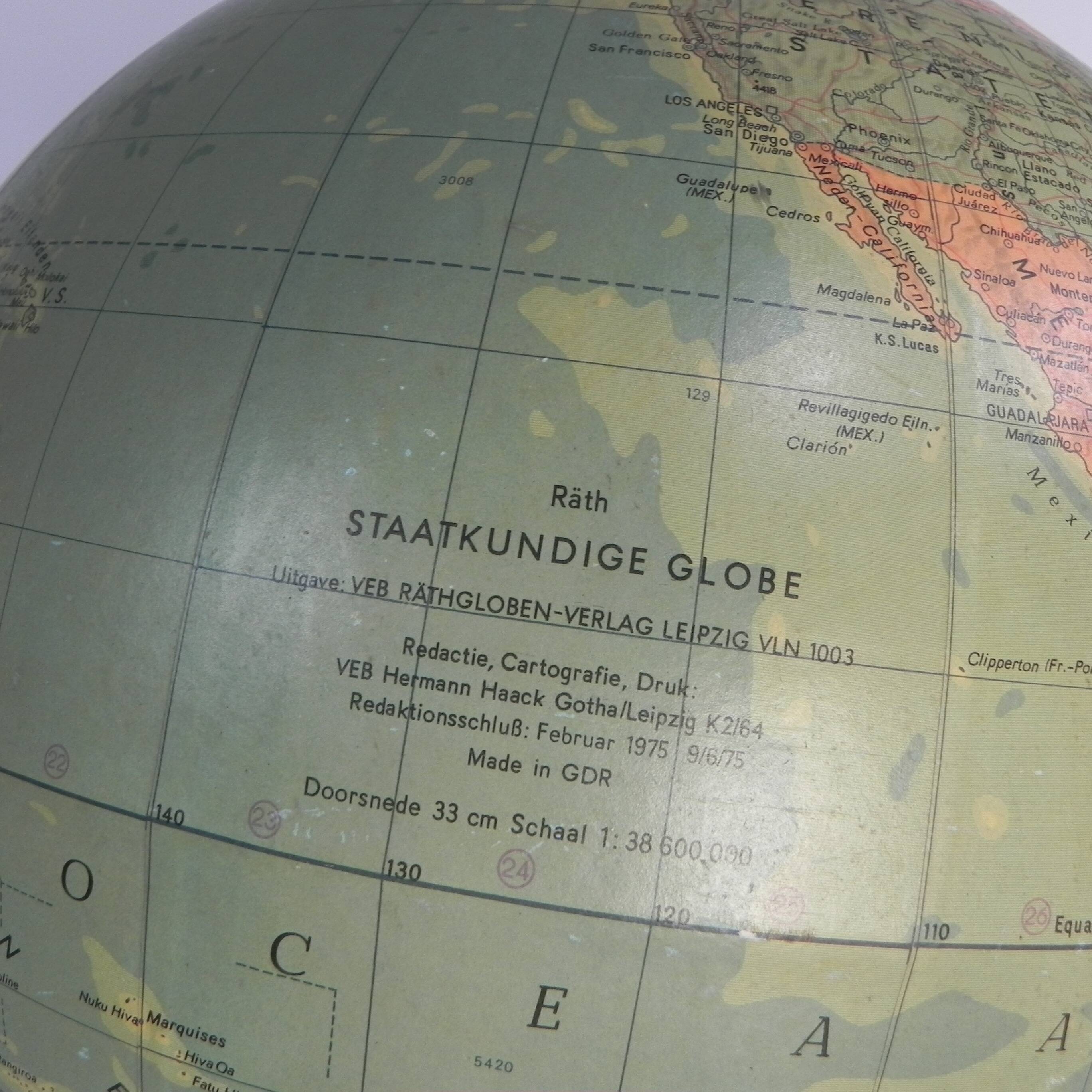 Paper mache globe on a wooden base, 1975
