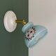 Vintage wall sconce with blue opaline glass shade and floral decorations