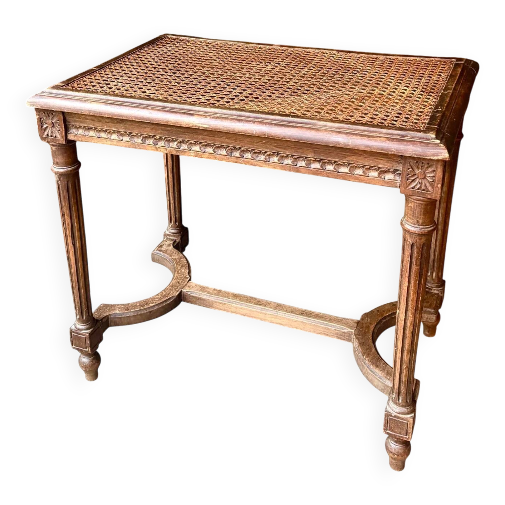 Stool, small wooden piano bench with carved details and caning.