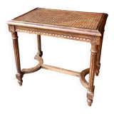 Stool, small wooden piano bench with carved details and caning.
