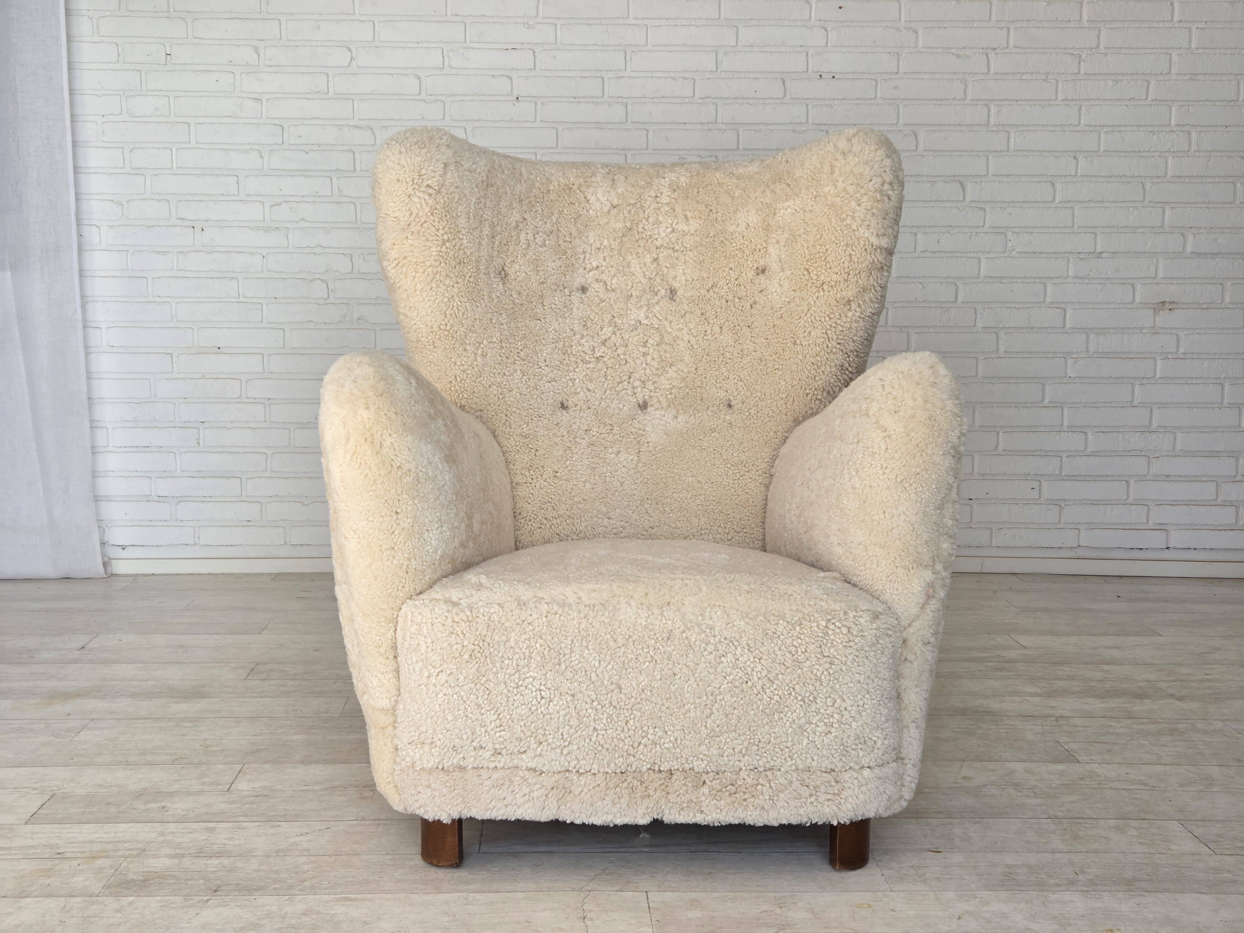 1960s, Danish armchair, genuine sheepskin "Canberra", reupholstered.