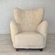 Fauteuil danois des années 1960, en véritable peau de mouton "Canberra", retapissé.