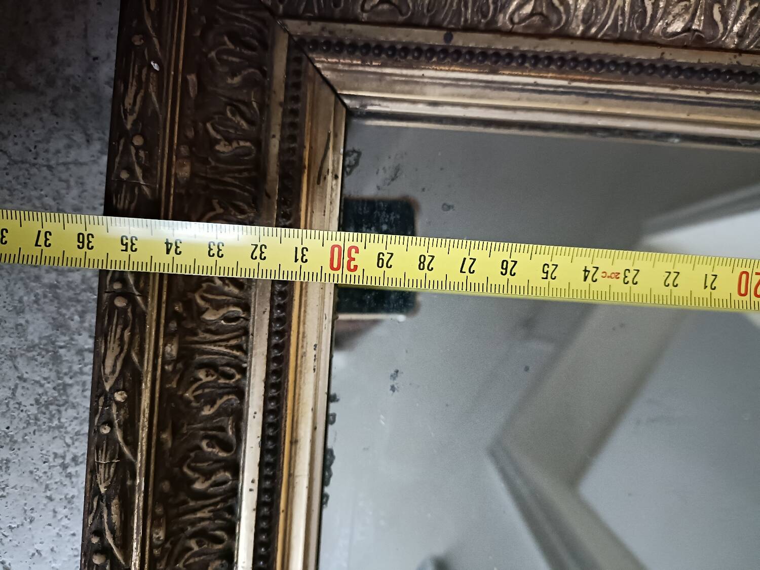 Antique mirror in wood and gilded stucco