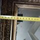 Antique mirror in wood and gilded stucco