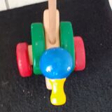Colored wooden toy; to push or drag