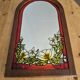 A pair of vintage stained glass style mirrors.