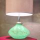 1950s lamp with a linen shade, lighting in the green glass base, pl.