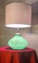 1950s lamp with a linen shade, lighting in the green glass base, pl.