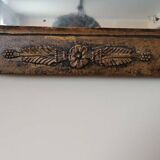 Small antique Empire mirror in gilded wood painted on glass