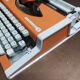 Olympia traveller luxury typewriter orange revised and new ribbon