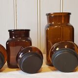 Series of 4  amber glass jars 70