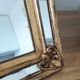 Miroir à pareclose doré