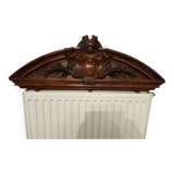old pediment in carved walnut