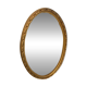 Golden oval mirror
