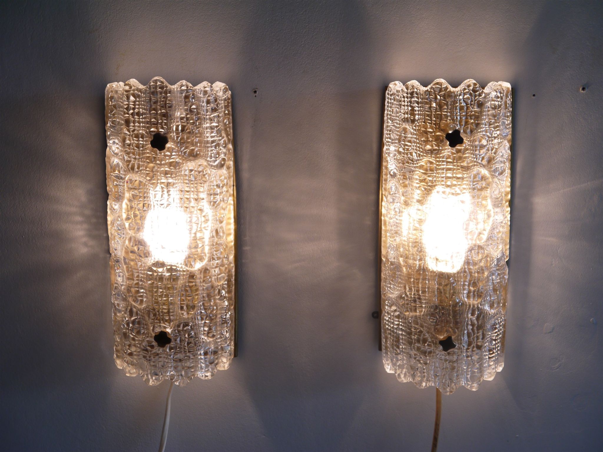 Pair of brass and crystal appliques by Carl Fagerlund for Orrefors