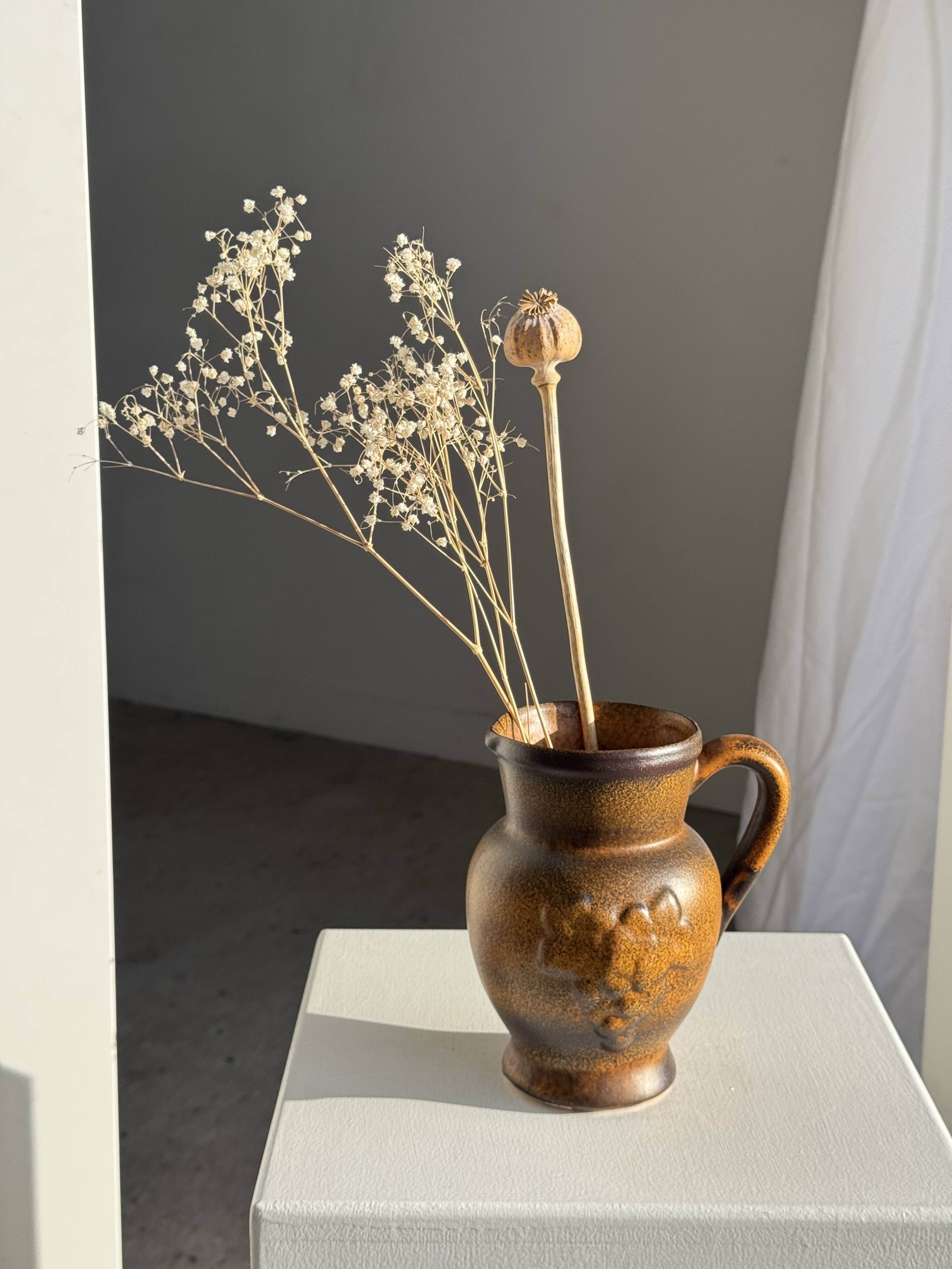 Speckled stoneware jug with grape pattern H17