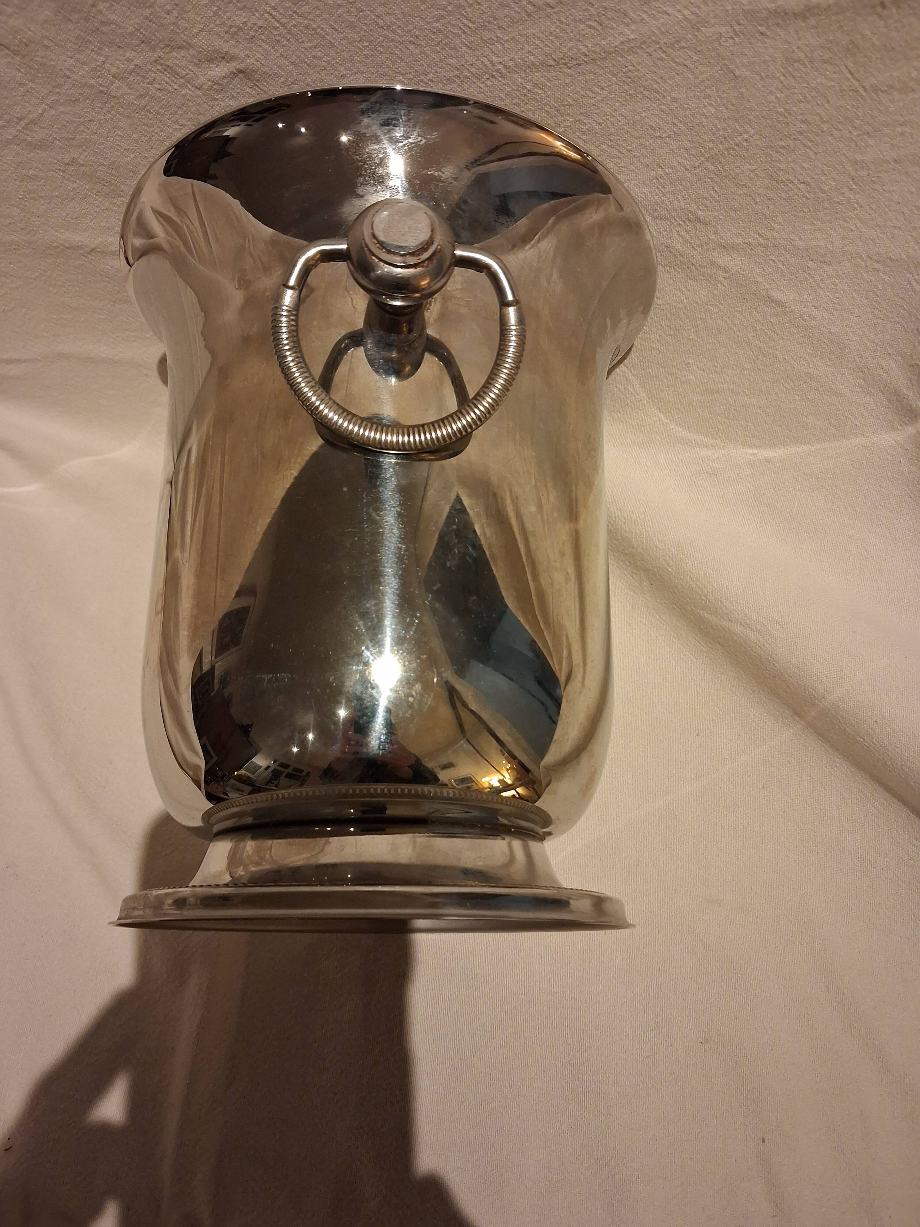 Stainless steel champagne bucket, silversmith Jean Couzon, model on a pedestal.