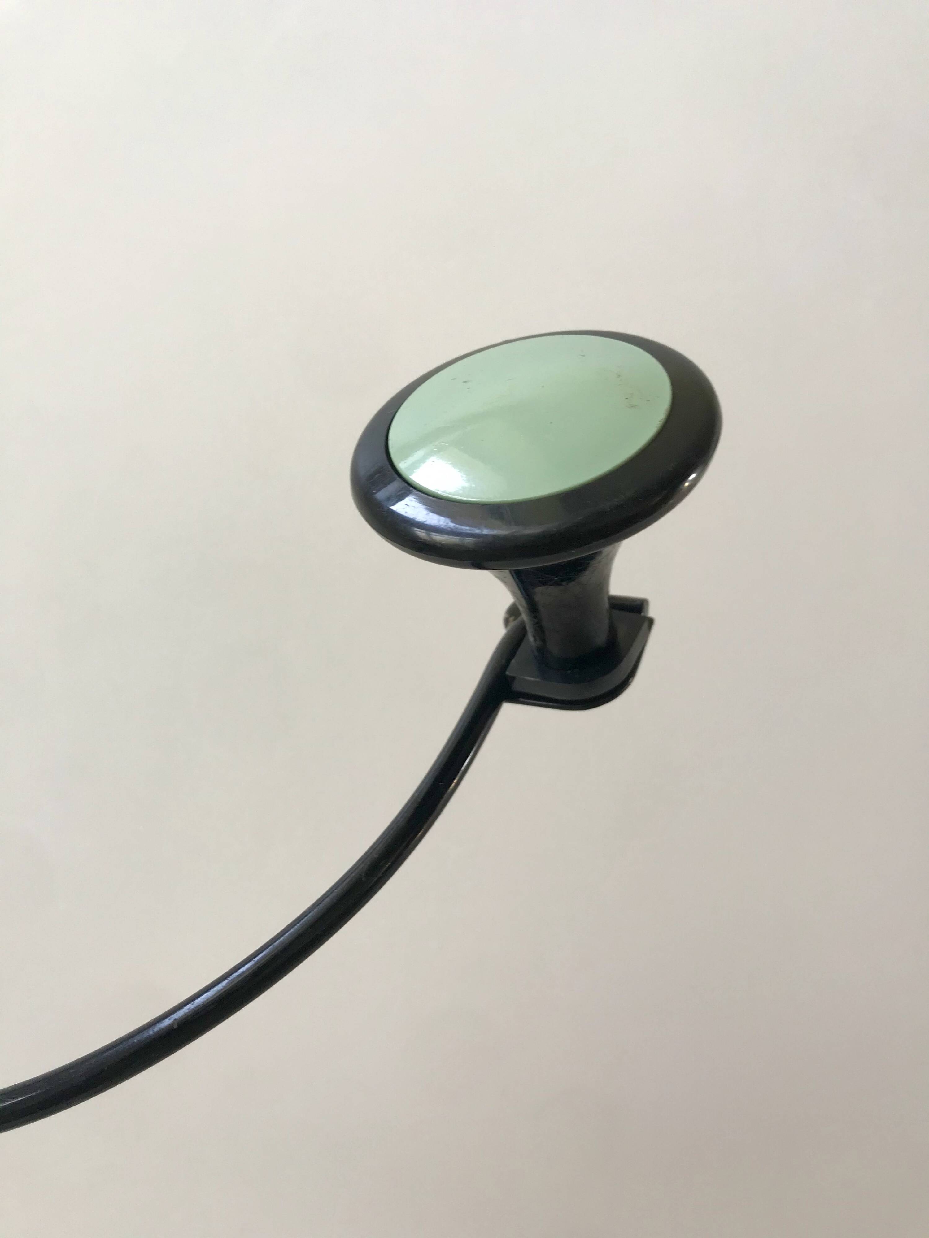 Design coat hook in sage green and black metal from the 70s