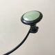 Design coat hook in sage green and black metal from the 70s