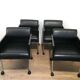 Suite de 4 fauteuils en cuir et métal laqué noir. Rosenthal