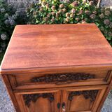 Art Deco sideboard bar cabinet in solid walnut with 3 doors and 1 richly carved tilting false drawer.