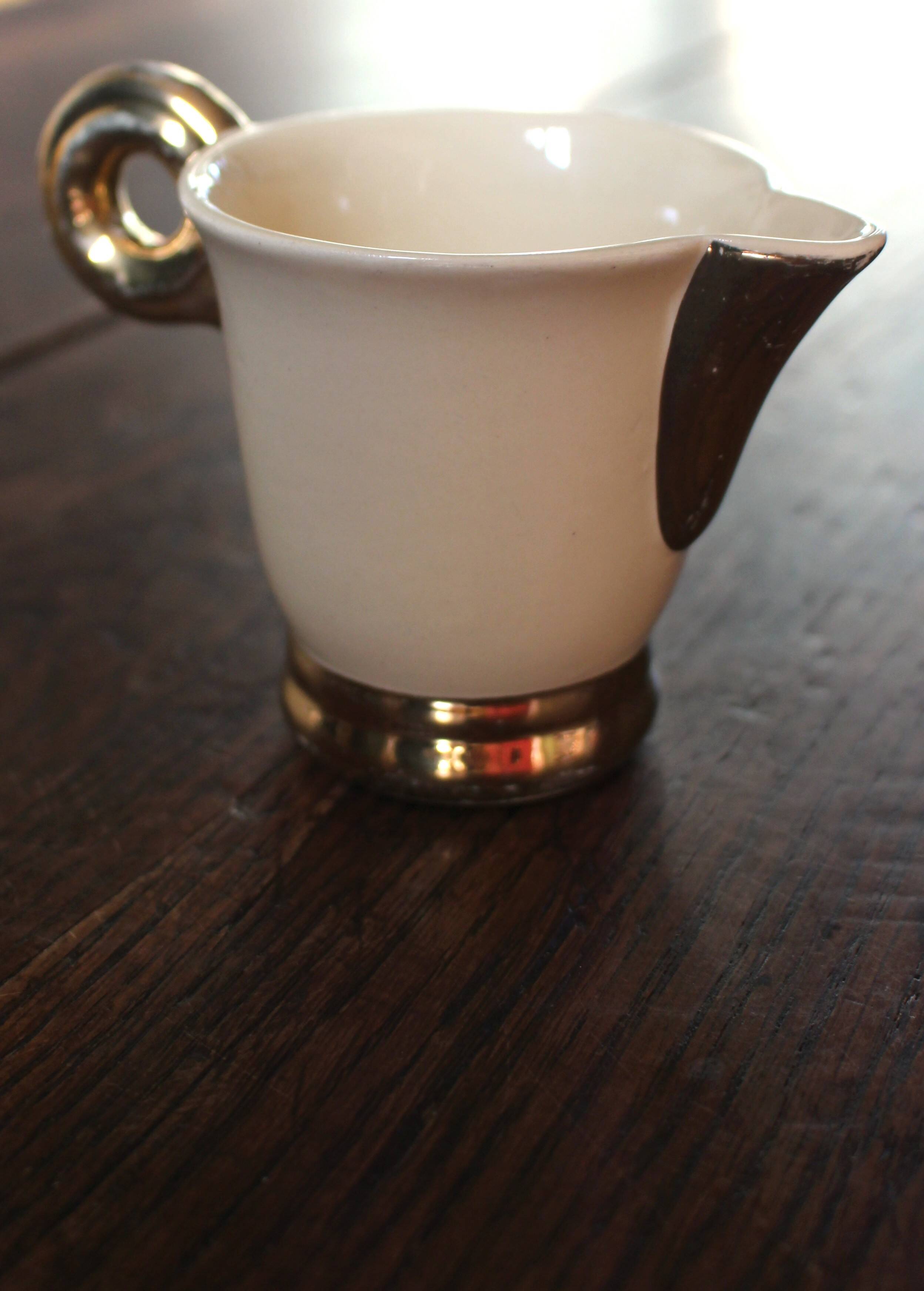 Ecru ceramic milk jug with gold decoration from Sarreguemines.