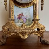 Napoleon III clock in gilded bronze and porcelain plates decorated and painted by hand