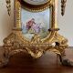 Napoleon III clock in gilded bronze and porcelain plates decorated and painted by hand