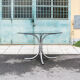 Round table in chromed metal and glass Italia Anni '60