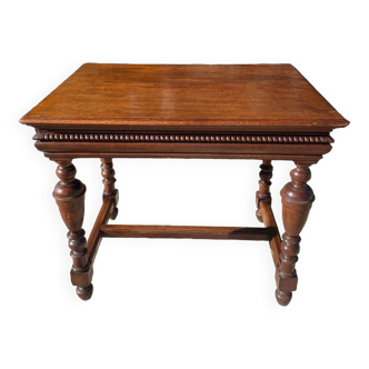 Richly carved and molded solid oak writing table in Louis XIII style