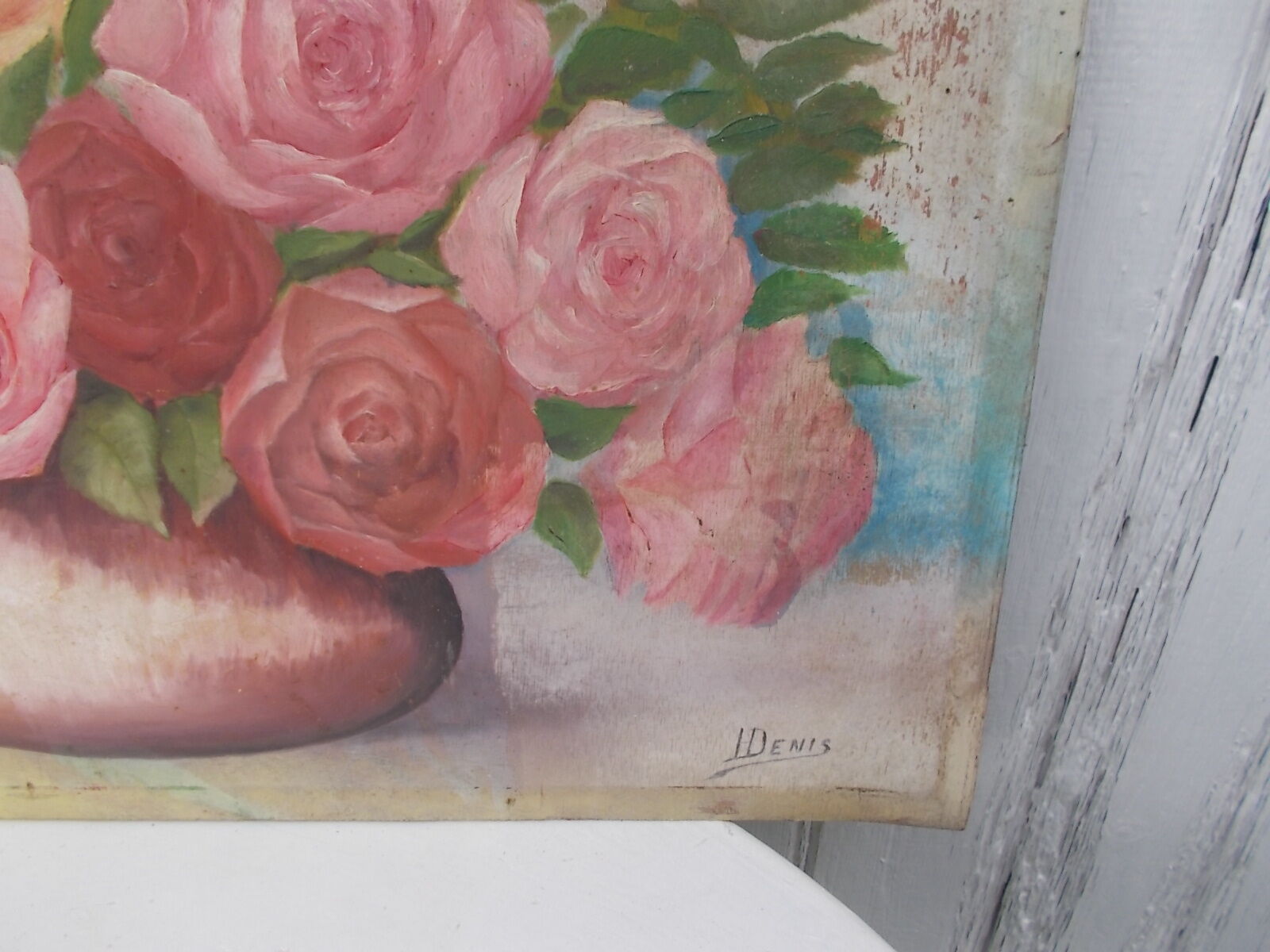 Tableau of a bouquet of flowers on a double-sided wooden panel.