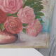 Tableau of a bouquet of flowers on a double-sided wooden panel.