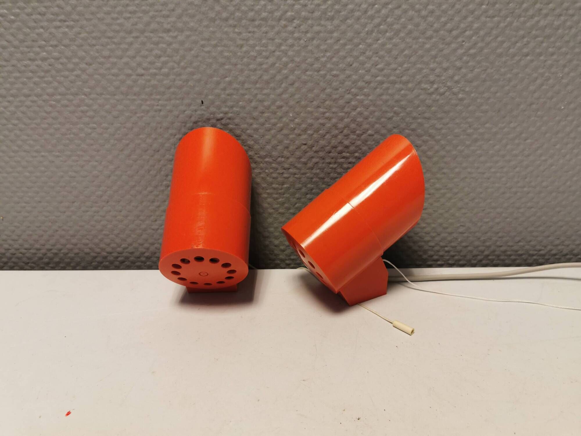 A set of "Nathue" wall lamps (meaning night cap) in a retro red colour, 1970s Denmark.