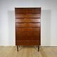 Mid-century Danish high chest of drawers with eight teak drawers.