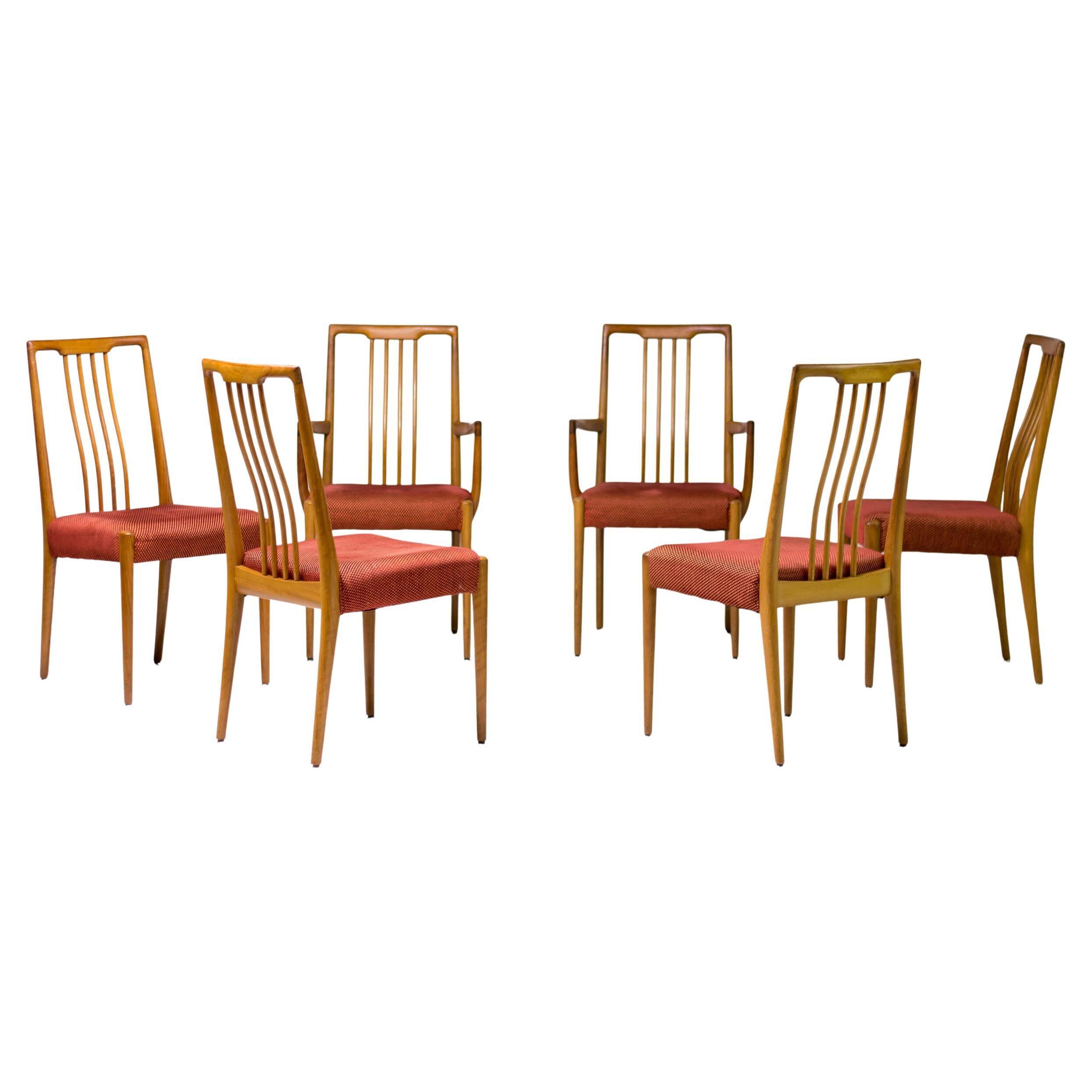 Set of six carved walnut dining chairs, Italy, 1955