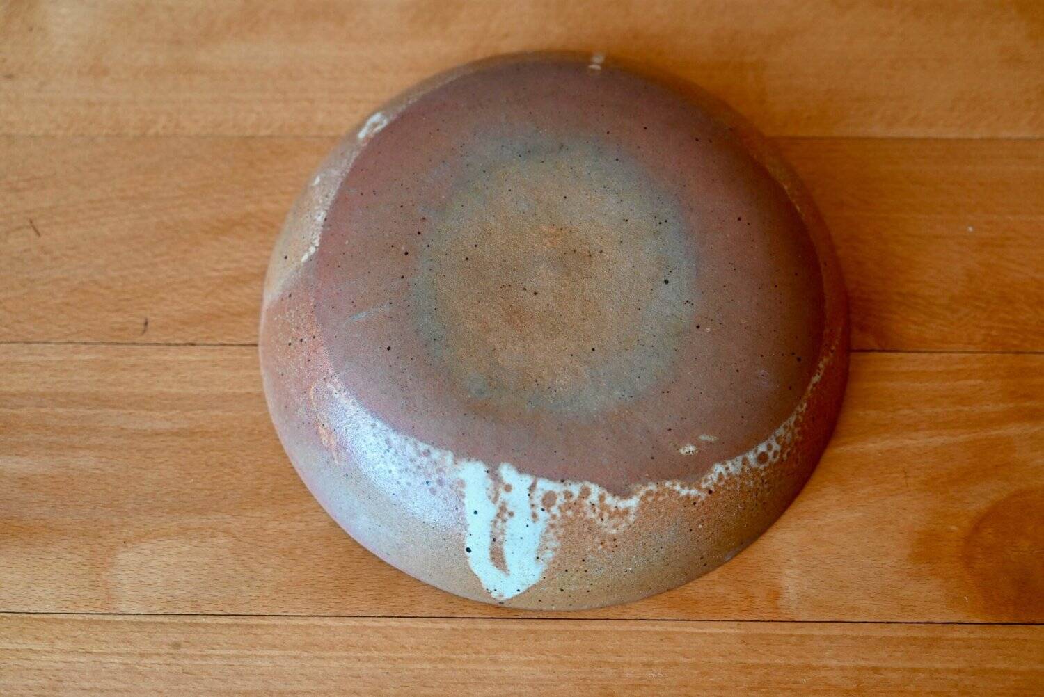 Set of 10 turned stoneware plates, pyritised and glazed, wabi-sabi brutalist.