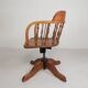 Oak office chair with a spring system and height adjustable, 1930s.