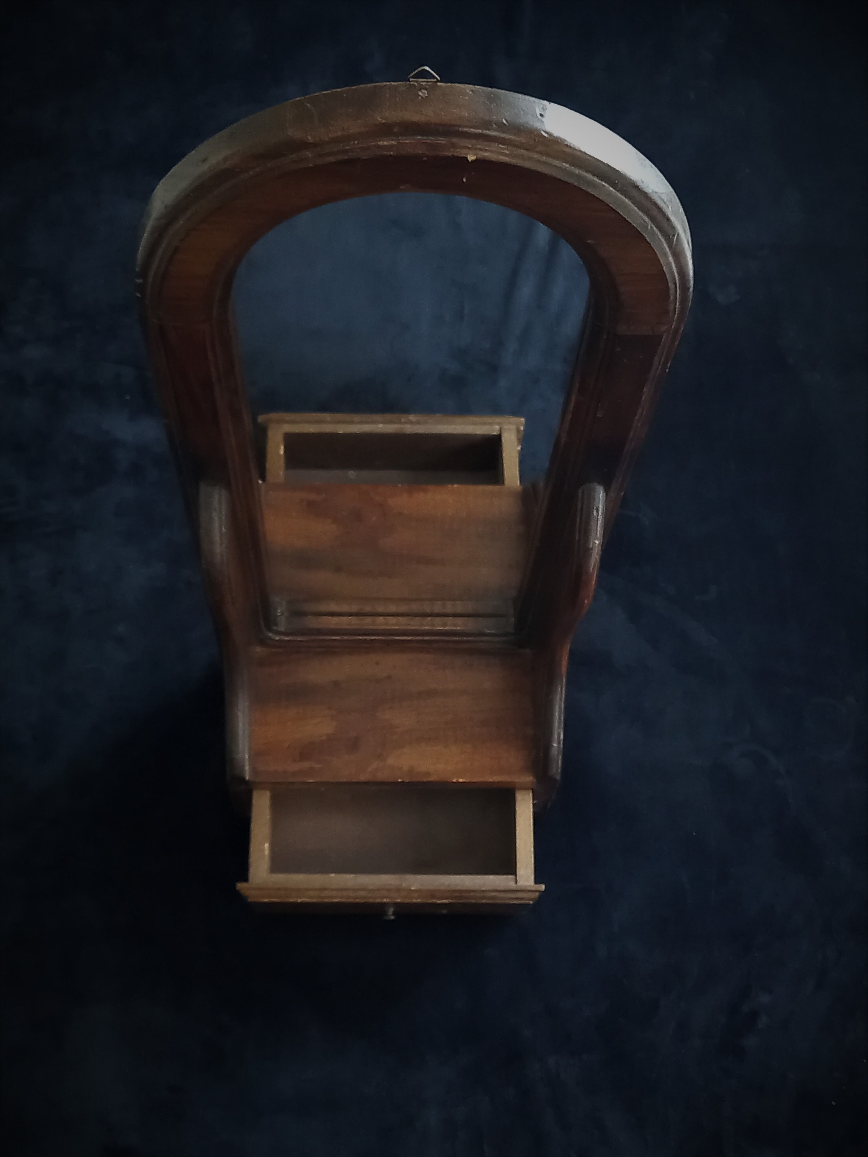 Wall mirror in arched frame with drawer