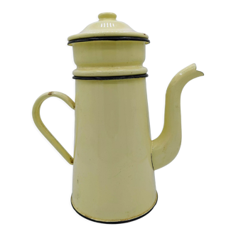 Old coffee maker in pastel yellow and black enamelled sheet metal