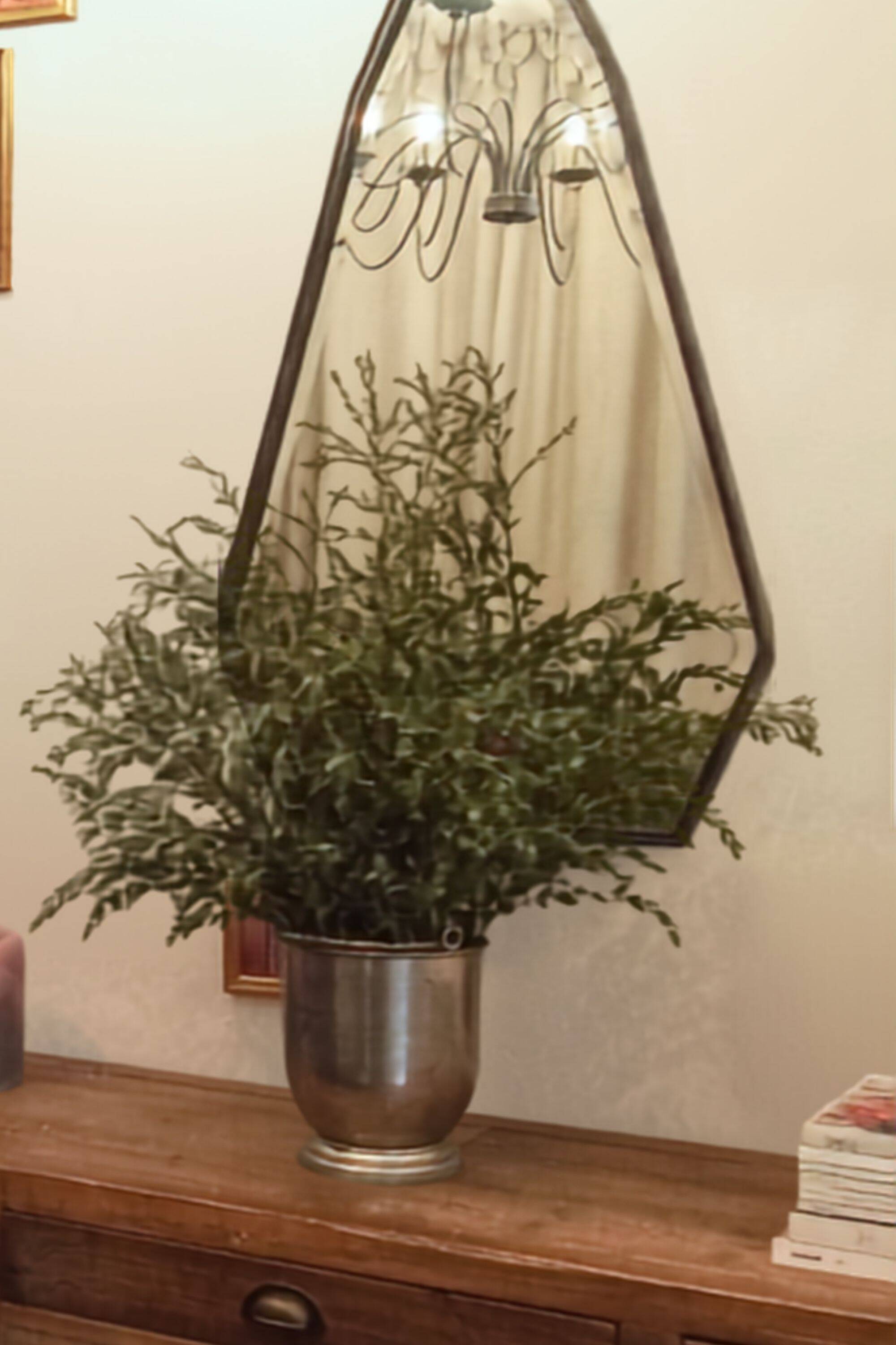 Pentagonal mirror with a black metal frame