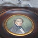Miniature portrait of a man in a wooden frame