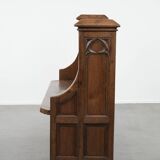 Antique oak church bench in Gothic style with beautiful wood carving