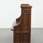 Antique oak church bench in Gothic style with beautiful wood carving