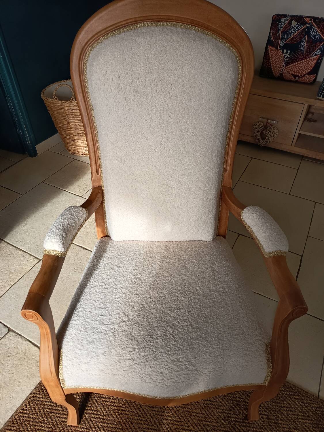 Renovated Voltaire armchair with boucle fabric.
